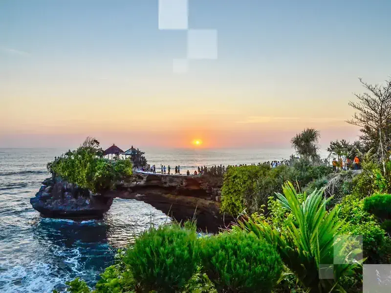 Catch an awesome sunset over the Tanah Lot Temple